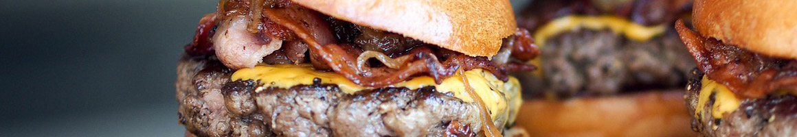 Eating Burger at MGM Burgers restaurant in Riverside, CA.